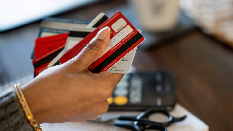 Woman's hand holding multiple credit cards
