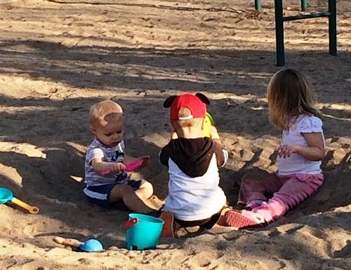 empowering kids at park sandbox