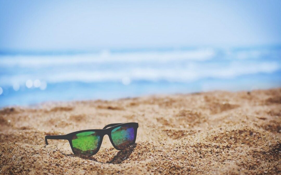 Sunglasses lying in the sand