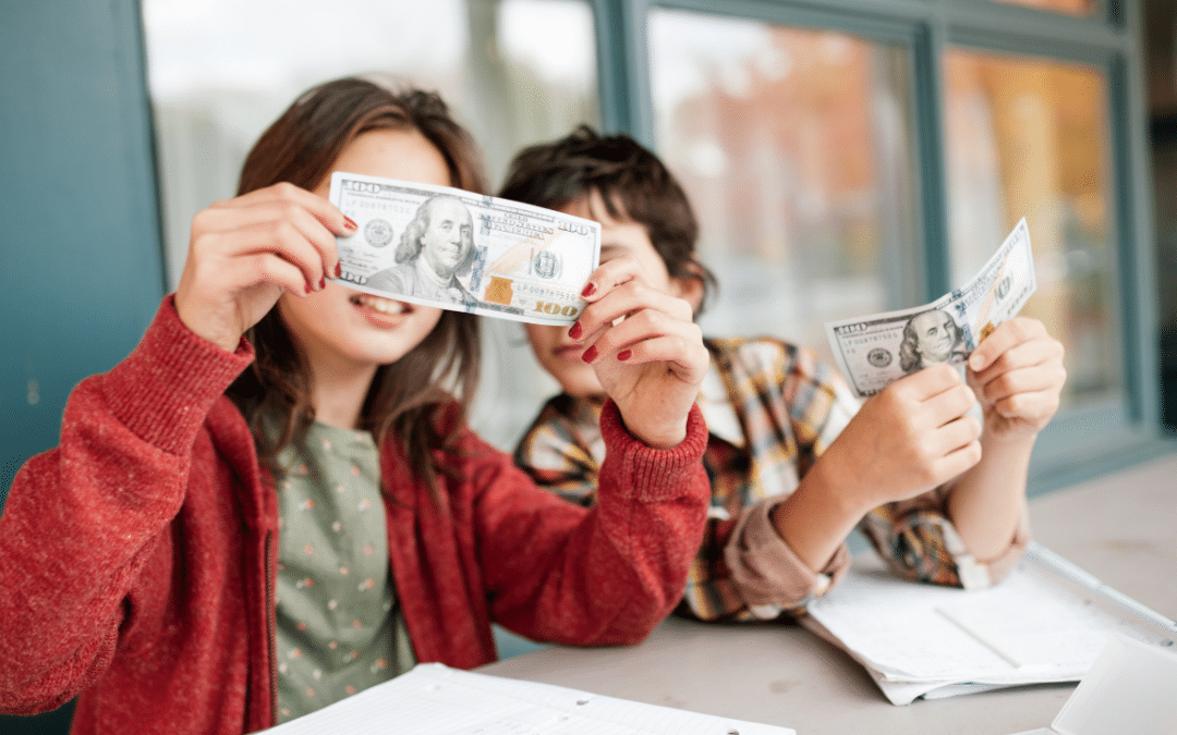Kids holding up money