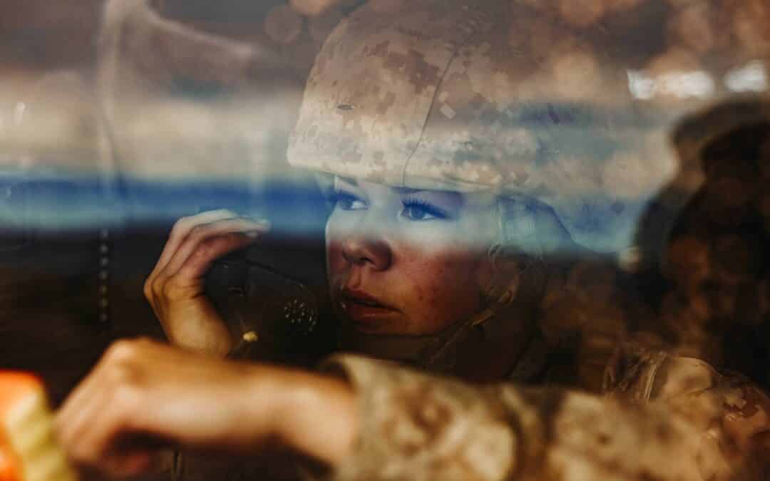 Marine Corps Lance Cpl. Megan Roundpoint communicates through a radio during an adversary force exercise at Marine Corps Air Ground Combat Center Twentynine Palms, Calif., Jan. 31, 2024.